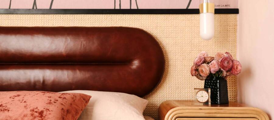 Headboard covered with leather by Cortina Leathers