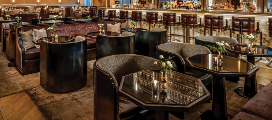 An image of a beautiful bar full of custom leather seating is a link to a page about calculating needs.