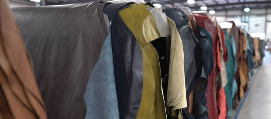 An image of colorful hides stacked in a long line of hide horses is a link to a page about Hide types and size.