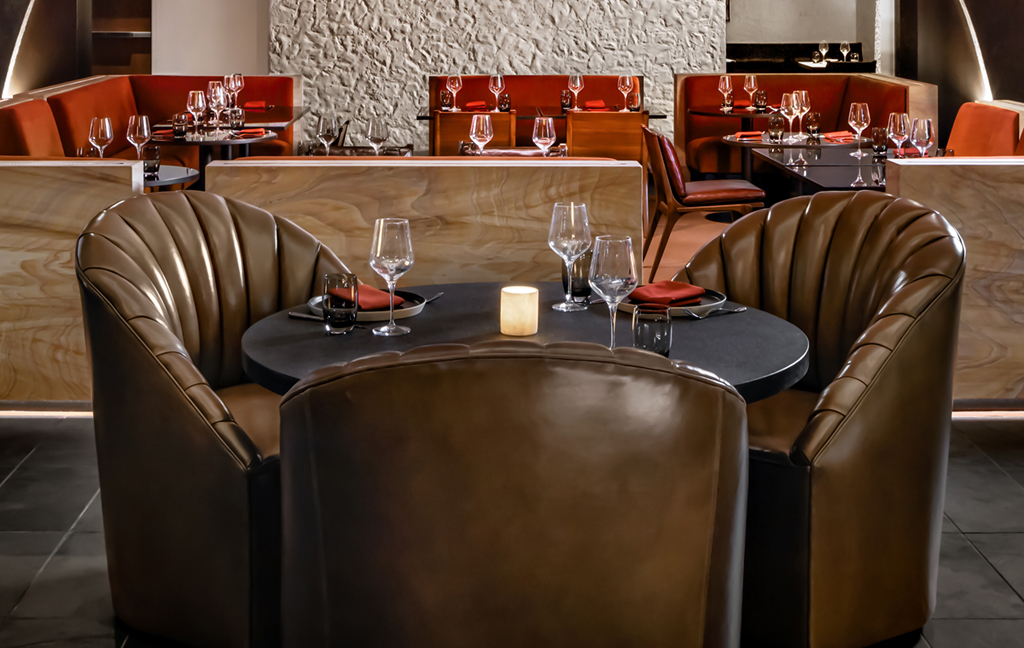 Close up of leather shell chairs using Cortina leathers in dining room..